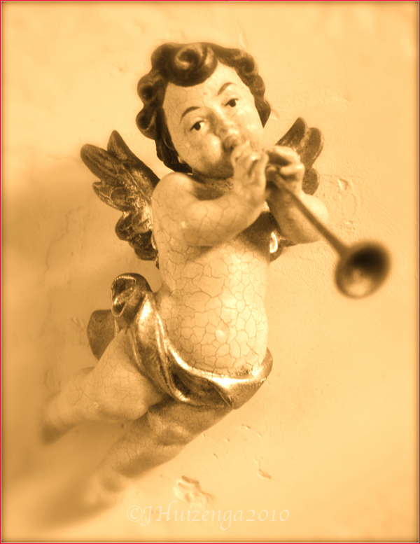 Winged wooden Sicilian cherub/angel/putto with trumpet, copyright Jann Huizenga