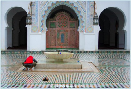 Man Praying in Fez Mosque, Morocco, copyright Jann Huizenga
