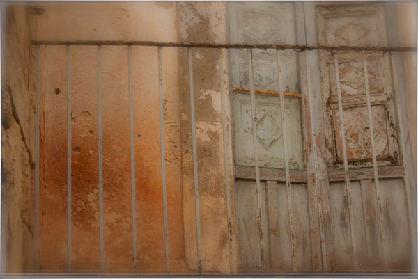 Sicilian Shutters on Orange Wall by Jann Huizenga