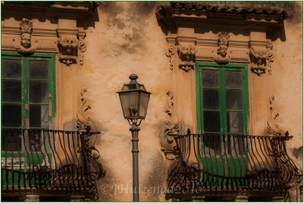 Windows in Scicli, Sicily, copyright Jann Huizenga