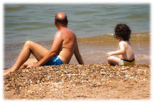 Sicilian Father and Son at Beach, copyright Jann Huizenga