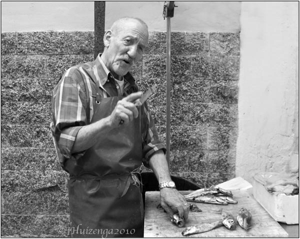 Fishmonger in Siracusa, Sicily, copyright Jann Huizenga