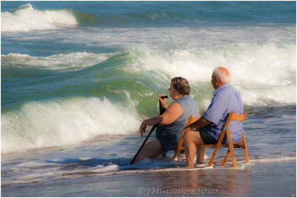 Elderly Sicilian Couple Sitting in Water, copyright Jann Huizenga