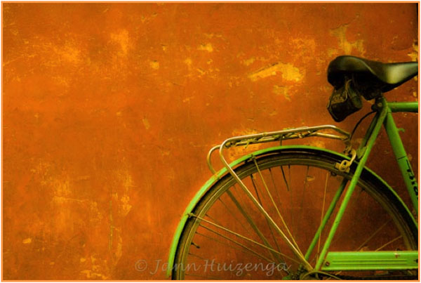 Green Bike on an Orange Wall, copyright Jann Huizenga