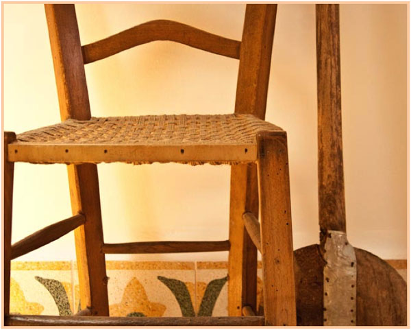 Old Sicilian church chair with woven seat, copyright Jann Huizenga