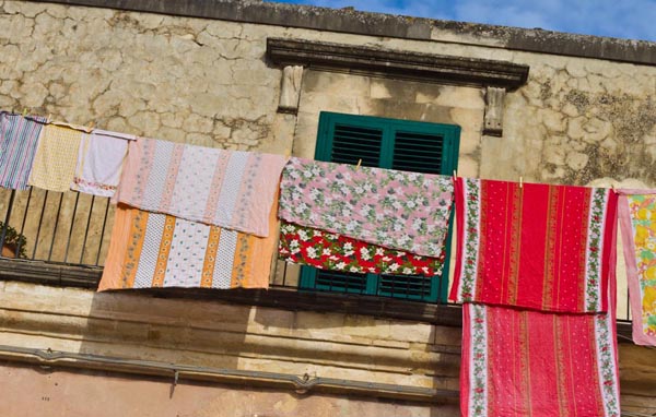Christmas tablecloths hung out to dry in Sicily, copyright Jann Huizenga