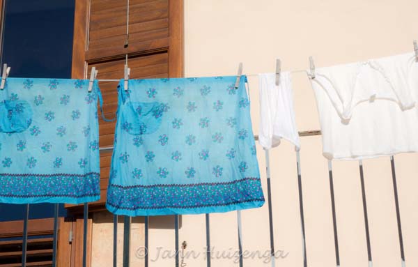 Aprons hanging on the line in Sicily, copyright Jann Huizenga