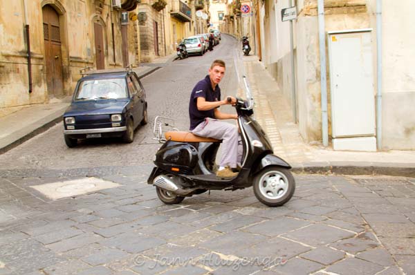 Boy on Bike in Sicily, copyright Jann Huizenga
