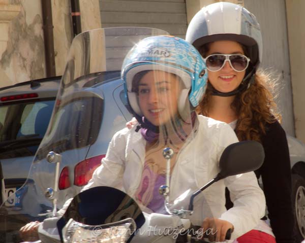Girls on Mopeds in Sicily, copyright Jann Huizenga