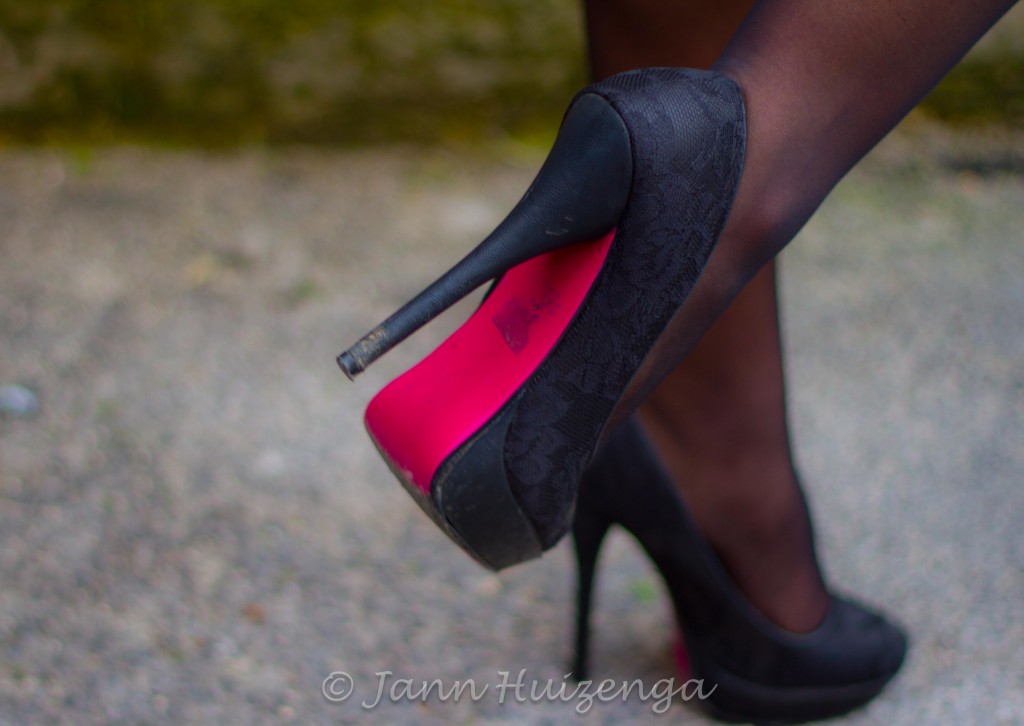 Women's Red-Soled Shoes in Sicily, copyright Jann Huizenga