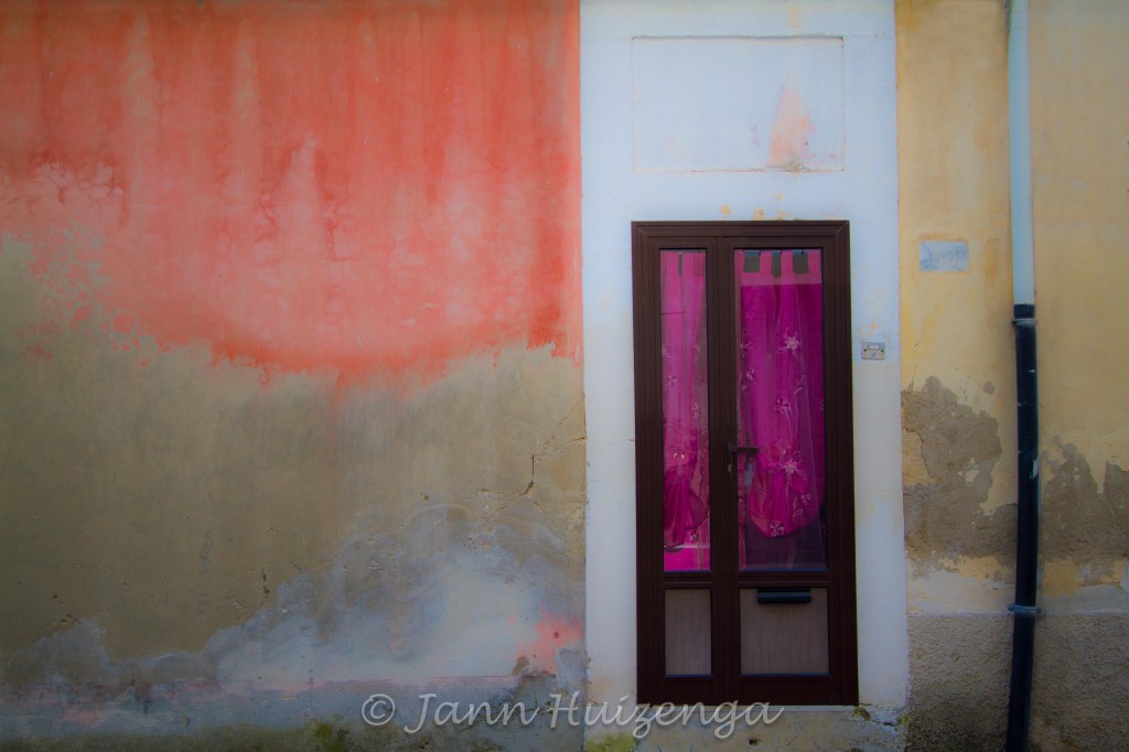 Pink Curtain in Sicilian Door and Orange Flame Wall in Southeast Sicily, copyright Jann Huizenga