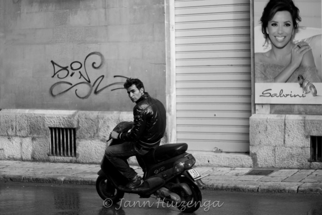 Sicilian Man Riding Scooter, copyright Jann Huizenga