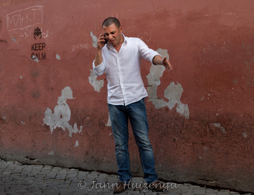 Roman Man on Phone; copyright Jann Huizenga