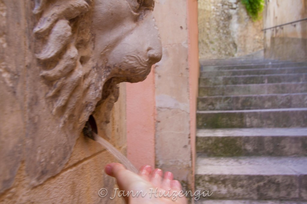 Stone Lion Fountain in Ragusa Ibla, Sicily, copyright Jann Huizenga